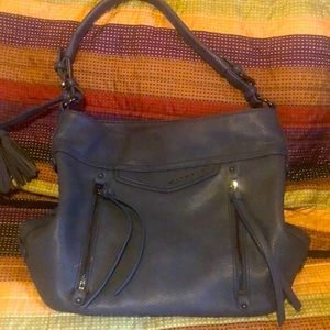 212 satchel handbag, small scuff on one front pocket, cute tassel details